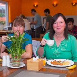 Having Breakfast at the Restaurant Having Breakfast at the Restaurant